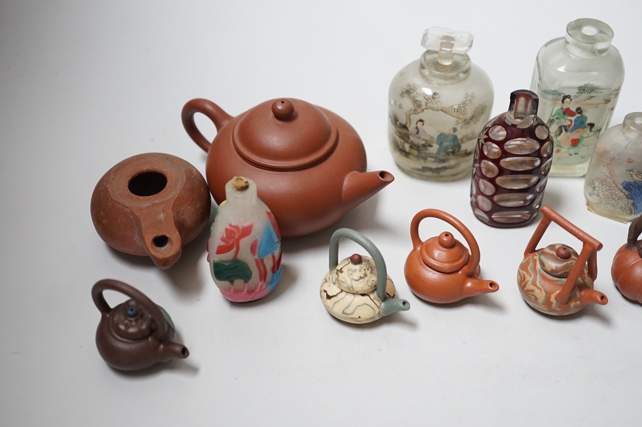 A collection of Chinese scent bottles, miniature and yixing teapots